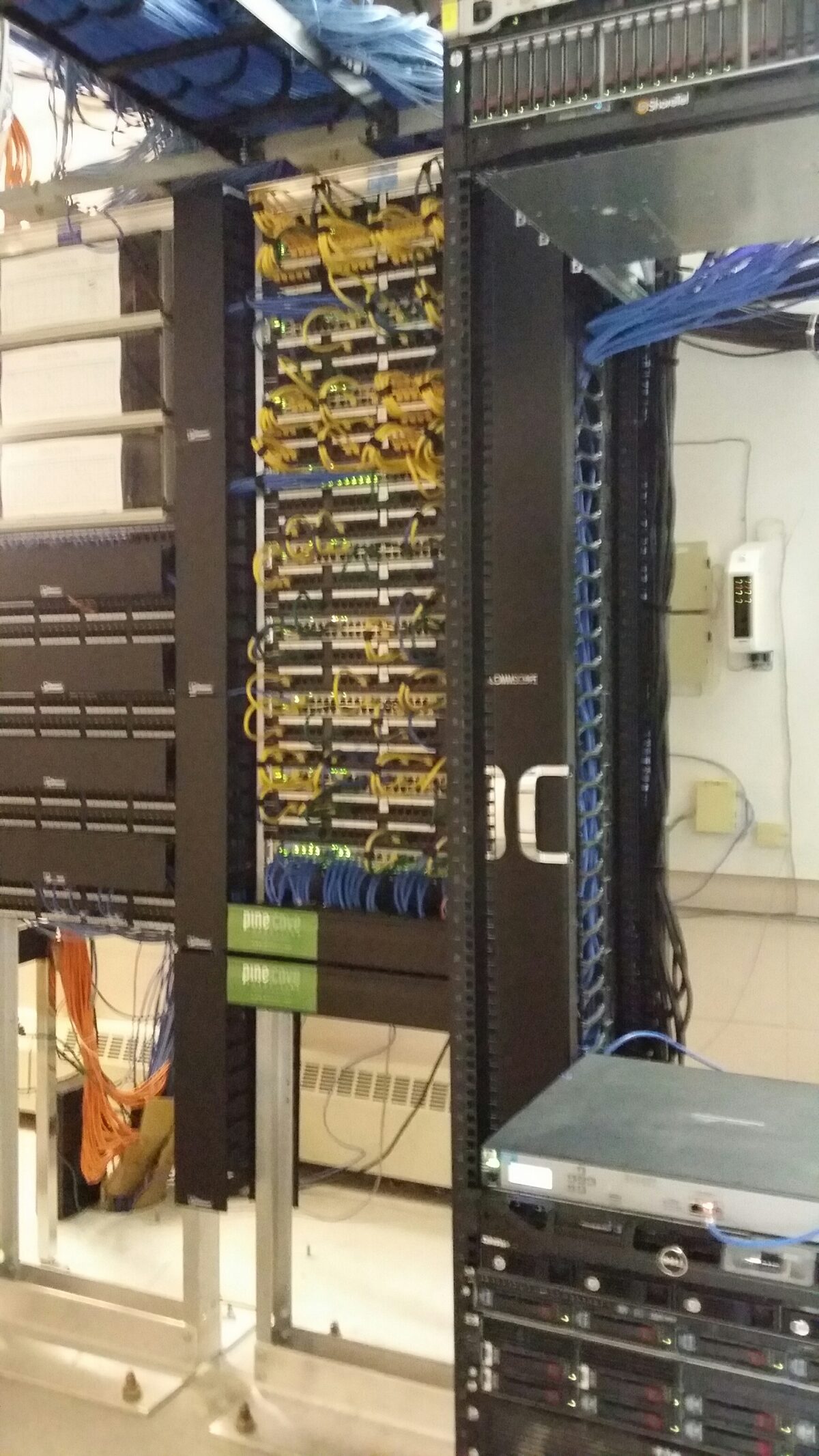 Cleanly organized, labeled network cabling in a server rack after Pine Cove work