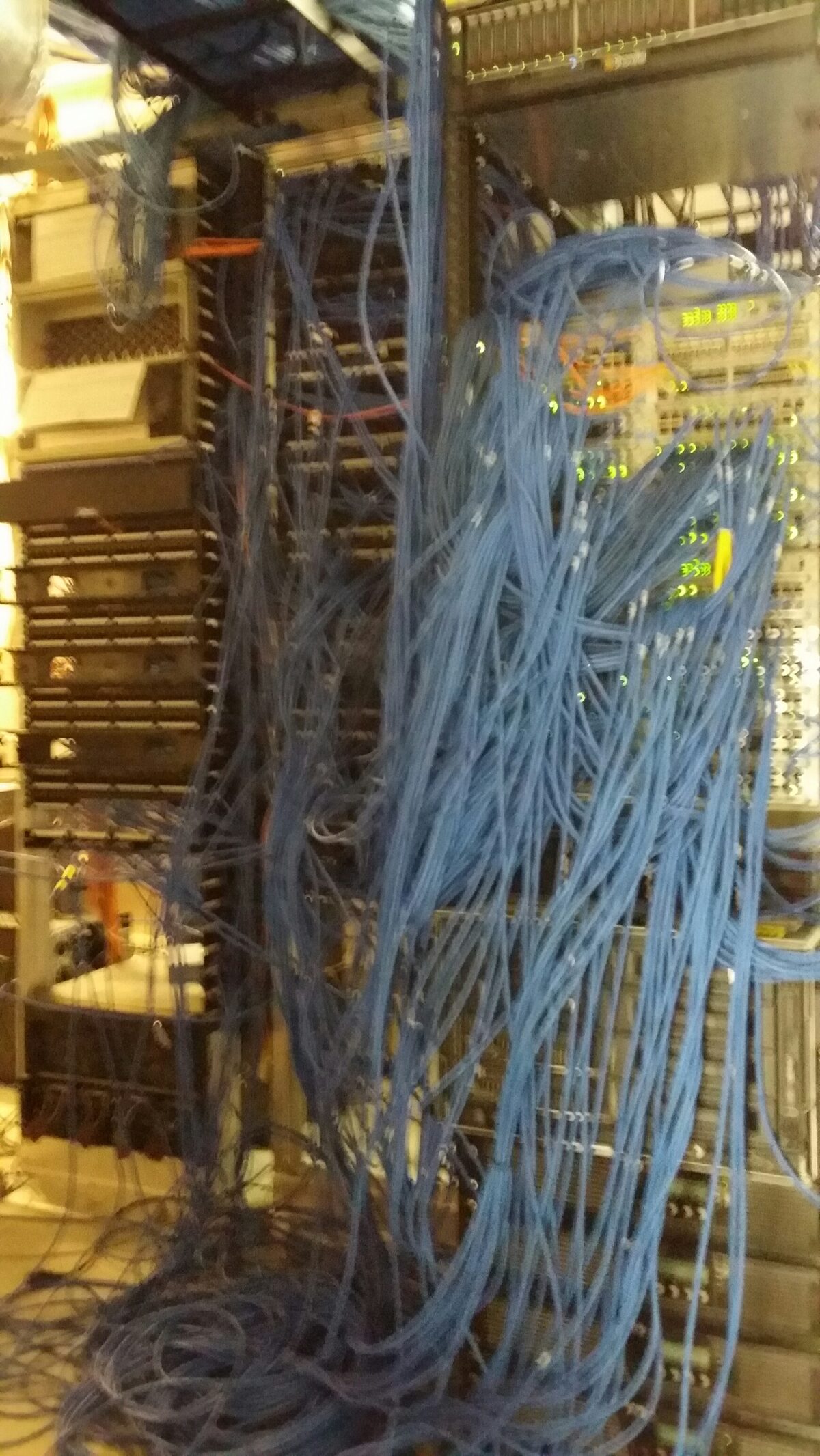 Disorganized, tangled network cabling in a server rack before Pine Cove cleanup